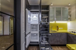 Kitchen refrigerator and oven next to each other photo