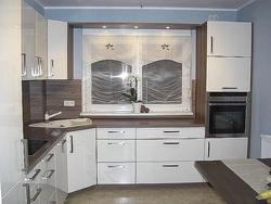 Photo of an oven built into a corner kitchen