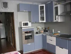 Photo of an oven built into a corner kitchen