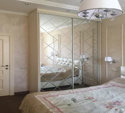 Sliding wardrobes with one mirror in the bedroom photo