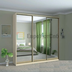 Sliding wardrobes with one mirror in the bedroom photo