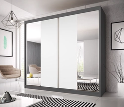 Sliding wardrobes with one mirror in the bedroom photo