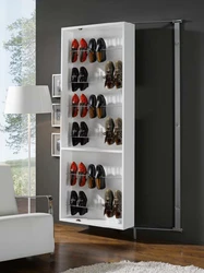 Shoe cabinet with mirror in the hallway photo