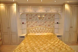 All the furniture in the bedroom is on one wall photo