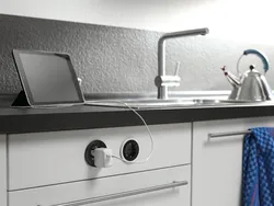 Sockets on the countertop in the kitchen photo in the interior