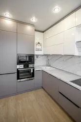 White kitchen with gray marble countertop photo