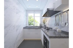 White kitchen with gray marble countertop photo