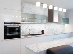 White kitchen with gray marble countertop photo