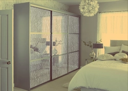 Wardrobe in the bedroom with a mirror photo dimensions