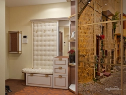 Hallway with ottoman and mirror and wardrobe photo