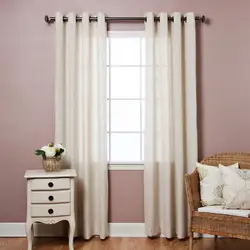 Tulle and curtains in the bedroom with grommets photo