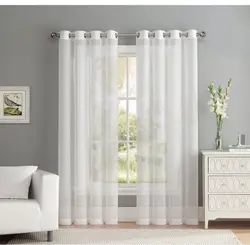 Tulle and curtains in the bedroom with grommets photo