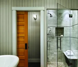 Glass doors to the bathroom and toilet photo