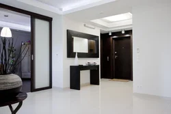 Light floor and dark wallpaper in the hallway photo