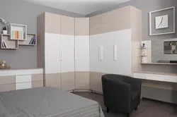 Bedroom with corner sofa and corner wardrobe photo