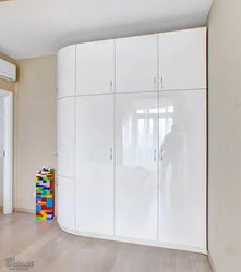 Wardrobe in the hallway white gloss with mirror photo