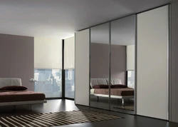 Wardrobe in the hallway with mirrors to the ceiling photo