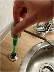 Built-in detergent dispenser in the kitchen photo