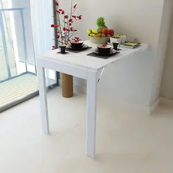 Kitchen tables photos that are attached to the wall