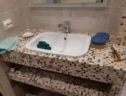 Countertop under the sink made of plasterboard in the bathroom photo