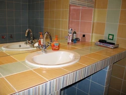 Countertop under the sink made of plasterboard in the bathroom photo