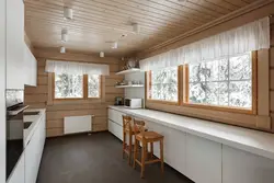 Ceiling design in the kitchen in a wooden house photo