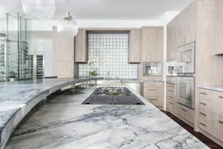 Photo Of A Kitchen With Marbled Porcelain Stoneware Floors