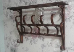 Coat rack with shelf in the hallway made of wood photo