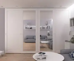 White wardrobe in the bedroom on the entire wall photo