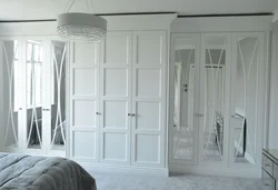 White wardrobe in the bedroom on the entire wall photo