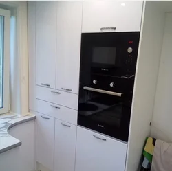 Kitchen oven and microwave in one cabinet photo