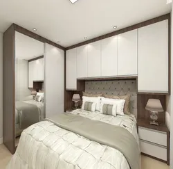 Wardrobe to the ceiling in the bedroom with suspended ceilings photo