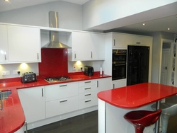 White Kitchen With Black Countertop And Bar Counter Photo