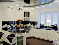 White kitchen with black countertop and bar counter photo