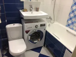 Toilet with washing machine and sink without bathtub design photo