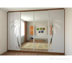Photo of wardrobes in the bedroom with a pattern on one mirror