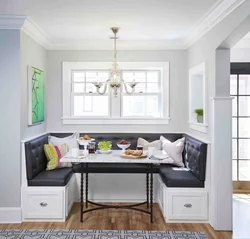 Dark sofa in the kitchen interior
