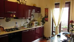 Burgundy curtains in the kitchen interior