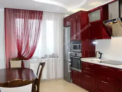 Burgundy curtains in the kitchen interior