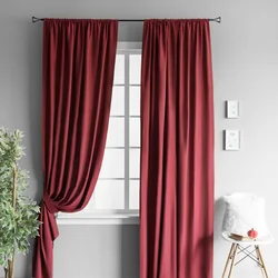 Burgundy curtains in the kitchen interior