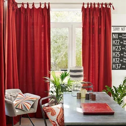 Burgundy curtains in the kitchen interior