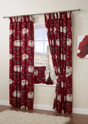 Burgundy curtains in the kitchen interior