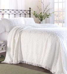 White bedspread in the bedroom interior