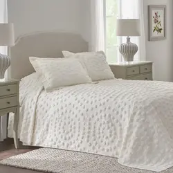 White bedspread in the bedroom interior