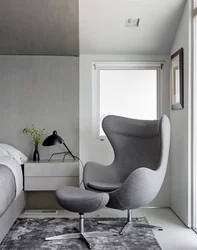 Gray armchair in the bedroom interior