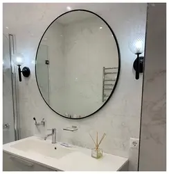 Black mirror in the bathroom interior