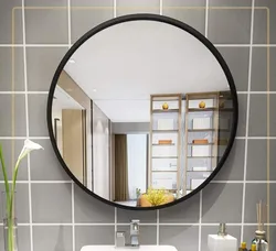 Black mirror in the bathroom interior