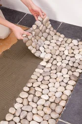 Pebble tiles in the bathroom interior