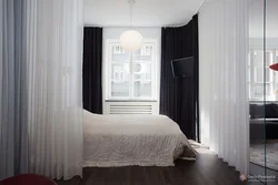 Bedroom Interior With Bed Behind Curtains