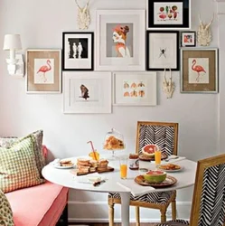 Wall with frames in the kitchen interior